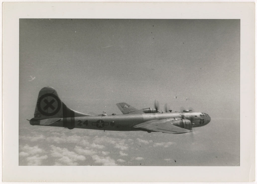 Photograph of a Boeing B-29 Superfortress aircraft (fuselage number 24, tail code Circle X) in flight, circa 1944-1952.